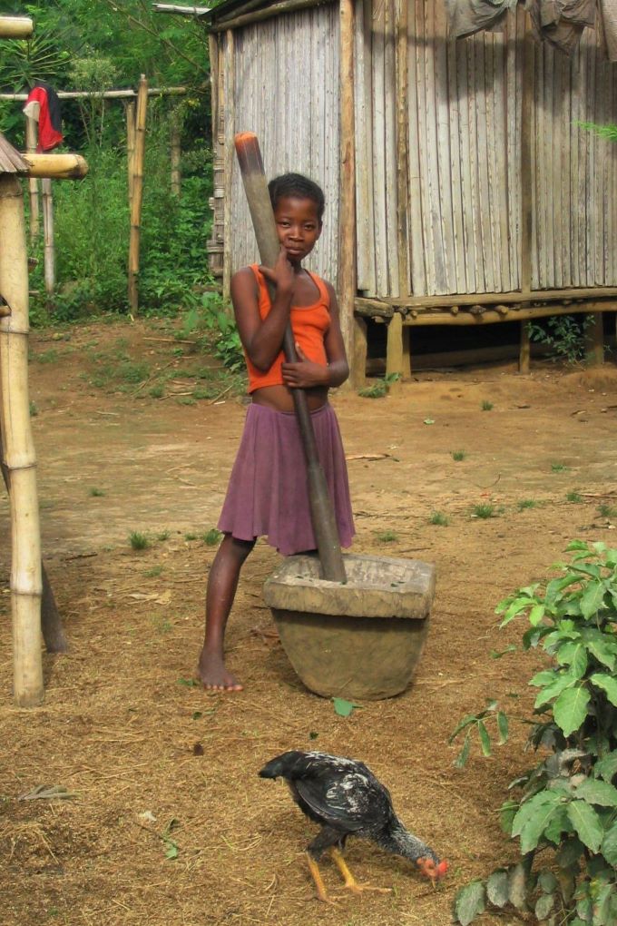 Girl pounding rice